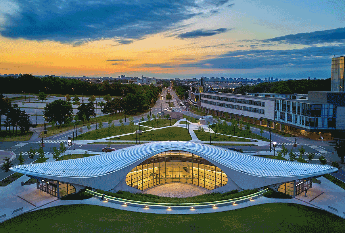Foster &amp; Partners designed Toronto's York University Station in a boomerang shape with mirrors installed on the underside of a canopy to reflect the movement of passengers walking through the space. (Foster &amp; Partners)
