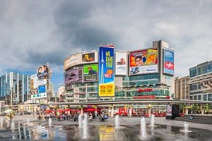 Canadian shoppers in the central downtown plaza of Yonge-Dundas Square beside the Eaton Centre in Toronto. Although Canadian consumers spent sharply in the spring, overall economic growth declined due to trade concerns. (Getty Images)