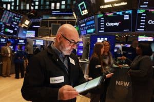 NEW YORK, NEW YORK - DECEMBER 30: Traders work on the floor of the New York Stock Exchange (NYSE) on December 30, 2025 in New York City. The Dow opened largely unchanged in morning trading following its steepest one-day decline in nearly two weeks. (Photo by Spencer Platt/Getty Images) (Getty Images)