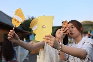 People attend the Roadside Fair during the 2024 Shanghai Summer-Xiaohongshu Street Lifestyle Festival by the Huangpu River. (Getty Images)