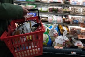 A shopper purchasing Thanksgiving groceries at a market. Food inflation remains elevated in Canada. (Getty Images)