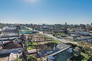 A year after fires swept through Pacific Palisades, the landscape is transforming as builders clear lots and lay foundations for new homes. (Kalina Mondzholovska/CoStar)