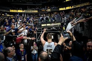 Nikola Jokic (15) of the Denver Nuggets celebrates as he leaves the court after the fourth quarter of the Nuggets' 94-89 NBA Finals clinching win at Ball Arena in Denver on June 12. (Denver Post/Getty Images)