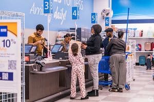 The value of the dollar fell in 2025. Above, shoppers pay for goods at a store in New Jersey. (Chris Pirone/CoStar)