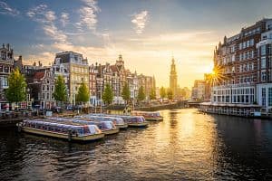 Sunset in Amsterdam with the Muntorren in the background (Getty Images)