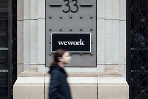 A sign for WeWork at the company's La Fayette co-working office space in Paris, France, on Thursday, Feb. 24, 2023. Photographer: Cyril Marcilhacy/Bloomberg via Getty Images.