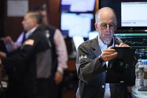 Traders work on the floor of the New York Stock Exchange during morning trading on Aug. 26 in New York City. (Getty Images)