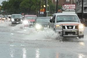 Drivers navigate high water on Yale Street in the Heights after a strong storm blew in on Tuesday, May 28, in Houston. Hotels in Houston and Dallas saw a demand boost as thunderstorms and tornadoes moved through the area last week. (Getty Images)