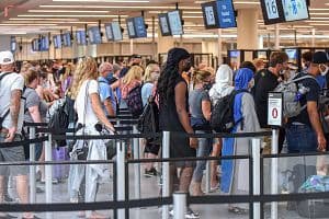 Travelers wait in line for TSA security screening at Orlando International Airport. (Getty Images)