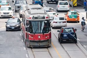 A Toronto Transit Commission Bombardier streetcar moves through traffic.  (Getty Images)